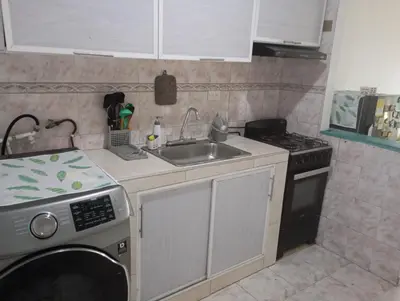 a small kitchen with a sink and a stove at @casa_grace Bienvenidos! in Cartagena de Indias