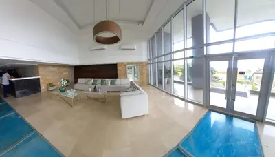 a living room with a couch and a pool at APARTAMENTO OCEAN DRIVE 410 CARTAGENA in Cartagena de Indias
