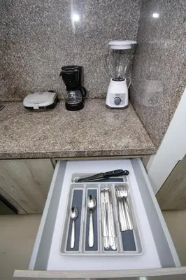 a kitchen counter with a sink and a blender at APARTAMENTO OCEAN DRIVE 410 CARTAGENA in Cartagena de Indias