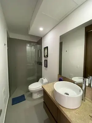 a bathroom with a sink and a toilet at Morros Cartagena frente a playa Hotel las Américas Edificio Spiaggia Apto Duplex in Cartagena de Indias