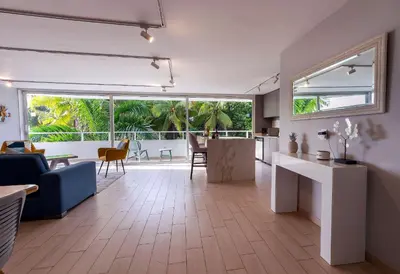 a living room with a couch and a table at U-GO Edificio Faro en El Laguito, Cartagena in Cartagena de Indias