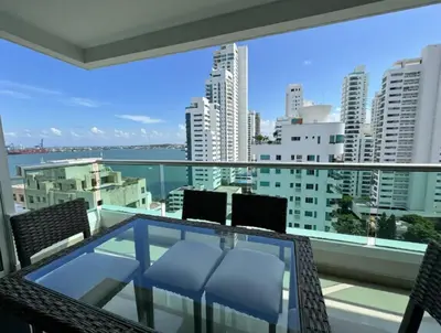 a balcony with chairs and a view of the city at Tres habitaciones - Vista al Mar in Cartagena de Indias
