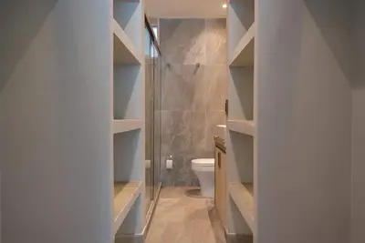 a bathroom with a toilet and a walk in shower at Tres habitaciones - Vista al Mar in Cartagena de Indias