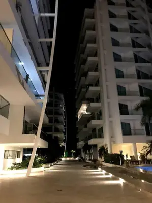 an empty street in front of two tall buildings at Sensacional Apartamento nuevo frente al mar in Cartagena de Indias