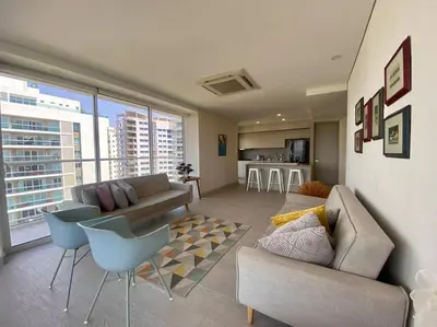 a living room with a couch and chairs and a kitchen at MQ 1006 Cartagena, Playa cercana in Cartagena de Indias