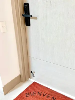 a door with a red rug in front of it at by Calamari Homes - Palmetto Beach 2504 Bocagrande in Cartagena de Indias