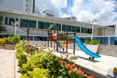 a playground with a slide in front of a building at Hermoso Apartamento vista al mar El Laguito in Cartagena de Indias