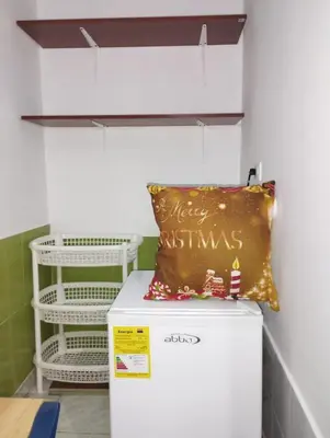 a pillow is sitting on top of a refrigerator at Habitación privada en Bocagrande in Cartagena de Indias