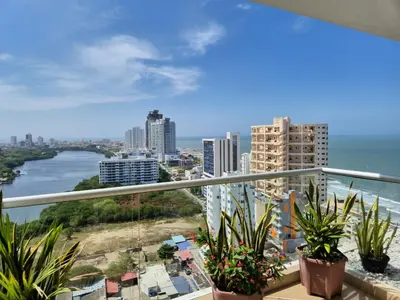 a balcony with a view of the ocean and buildings at Apartamento con vista al mar y al centro de Cartagena in Cartagena de Indias