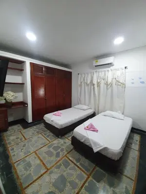 a room with two beds in a room at CASA ZOÉ in Cartagena de Indias