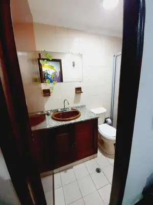 a bathroom with a sink and a toilet at CASA ZOÉ in Cartagena de Indias