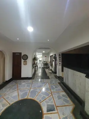 a hallway of a building with a tile floor at CASA ZOÉ in Cartagena de Indias