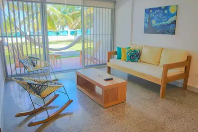a living room with a couch and a coffee table at Magico Apartamento Frente al Mar 3 Habitaciones C11A in Coveñas