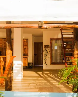 a living room with a ladder in a room at Hb1 Triple Room With Air Conditioning And WIFI in Cartagena de Indias