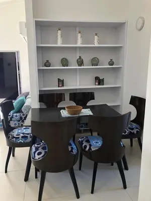 a dining room with a black table and chairs at Casa Bita Morales CASA 201 in Cartagena de Indias