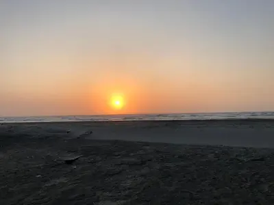 a sunset on a beach with the ocean at Casa Bita Morales CASA 201 in Cartagena de Indias