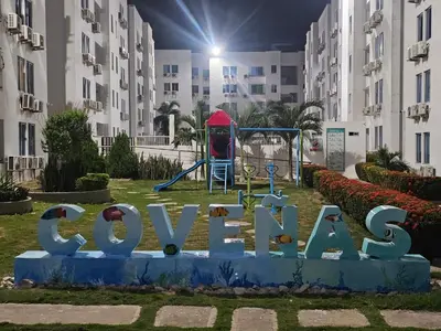 a sign in a park with a playground at Paraiso Coveñas, Unidad con la mejor piscina in Coveñas