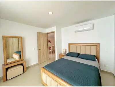 a bedroom with a bed and a mirror at Acogedor Marbella ideal familias mínimo 2 días in Cartagena de Indias