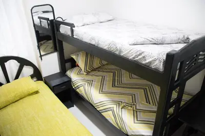 a couple of bunk beds in a room at Apartamento en Caribe campestre Coveñas in Coveñitas