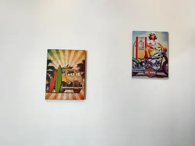 two pieces of art on a white wall at Apartamento la Isla 2-Coveñas in Coveñas