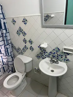 a bathroom with a toilet and a sink at Beach Airport House in Cartagena de Indias
