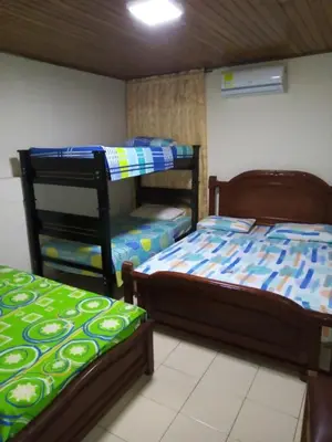 two bunk beds in a room withthritisthritisthritisthritisthritisthritisthritisthritisthritis at Hotel Colonial Inn in Barranquilla