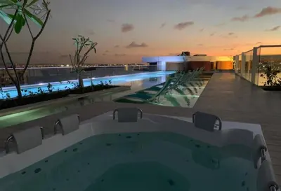 a view of a swimming pool at night at Apartamento en edificio con espectacular terraza in Cartagena de Indias