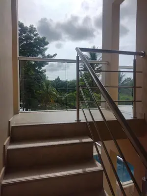 a staircase in a building with a view of a window at Cabañas OnBeach in San Antero