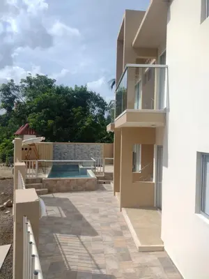 a house with a patio and a swimming pool at Cabañas OnBeach in San Antero