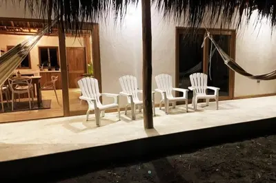 a group of chairs and a table in a house at Casita del Viento in San Bernardo del Viento
