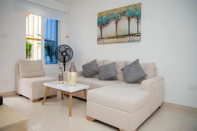 a living room with a couch and a table at CASA PETRA in Cartagena de Indias