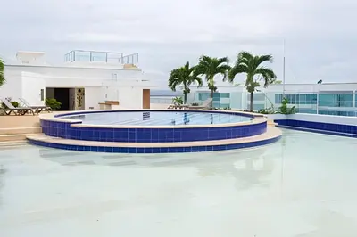 a swimming pool in the middle of a building at 2 Dormitorios Morros. Vista Ciénaga y salida playa in Cartagena de Indias