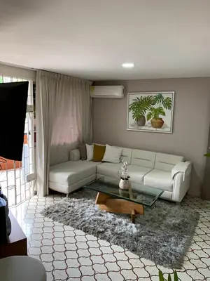 a living room with a white couch and a coffee table at Apartahotel Edificio Baquero x5 Apto 201 in Barranquilla