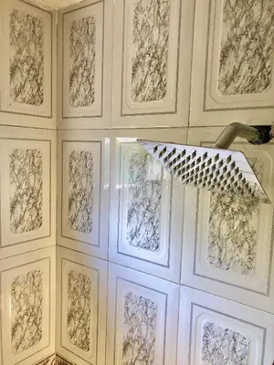 a white wall with framed drawings on it at Acogedor apartamento en bruselas in Cartagena de Indias