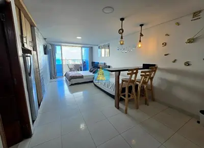 a living room with a table and a couch at Estudio Vista Laguna y Mar Piso 14 in Cartagena de Indias
