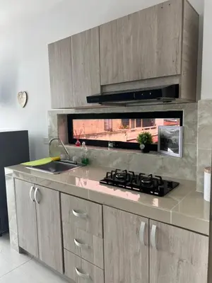 a kitchen with a sink and a stove top oven at Edificio Buenos Aires apartamento 304 moderno Sincelejo in Sincelejo