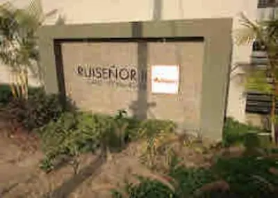 a building with a sign on the side of it at REFUGIO URBANO - Apartamento para descanso y trabajo remoto en Alameda del Río Barranquilla in Barranquilla