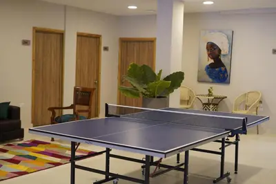 a ping pong table in a living room at Hostel Dorado Plaza Getsemaní in Cartagena de Indias