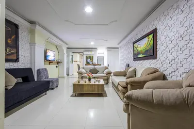 a living room with couches and a table at APARTAMENTO CATALINA BOCAGRANDE 1b in Cartagena de Indias