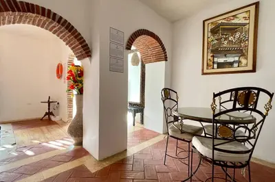 a dining room with a table and chairs at Gorgeous 8 BR House w/ Pool in the Old City in Cartagena de Indias