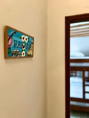 a picture hanging on a wall in a room at Colonial Beach Airport Hotel in Cartagena de Indias
