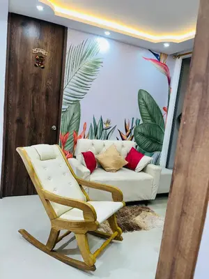 a living room with a chair and a couch at Habitación Disponible en Cartagena cerca a la terminal de transporte in Cartagena de Indias