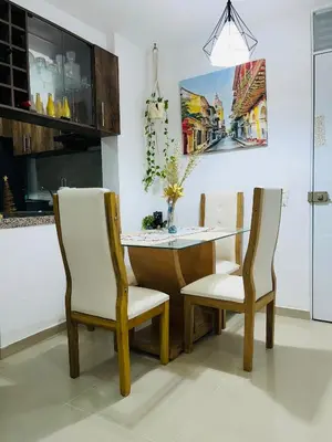 a dining room with a table and two chairs at Habitación Disponible en Cartagena cerca a la terminal de transporte in Cartagena de Indias