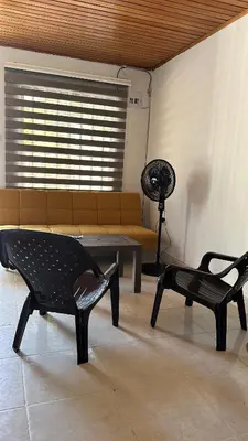 a living room with two chairs and a couch at Casa Tamarielys 3 Habitaciones in Cartagena de Indias