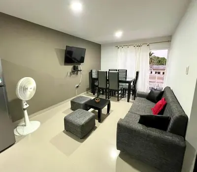 a living room with a couch and a table at Tu lugar ideal cerca al mar apartamento MyM in Coveñas