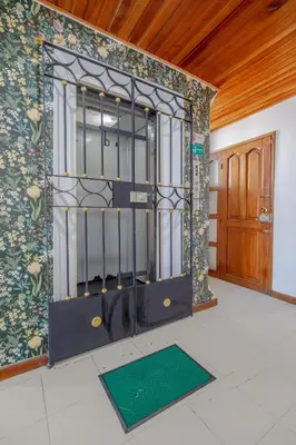 an iron gate in a room with a door at Amplia habitación con vista al mar y baño privado in Cartagena de Indias