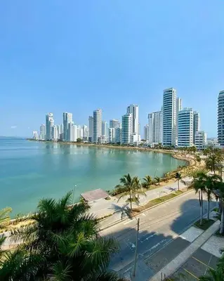 a view of a city with a beach and buildings at Amplia habitación con vista al mar y baño privado in Cartagena de Indias