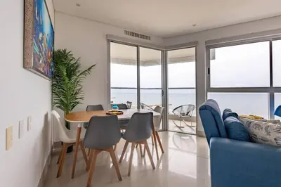 a dining room with a table and chairs at COMFORTABLE DEPARTAMENT IN FRONT THE SEA in Cartagena de Indias