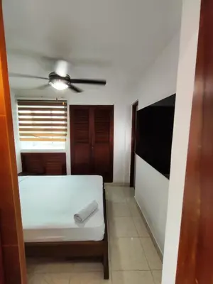 a room with a bed and a ceiling fan at APARTAMENTOS LOS MANGLARES marbella in Cartagena de Indias
