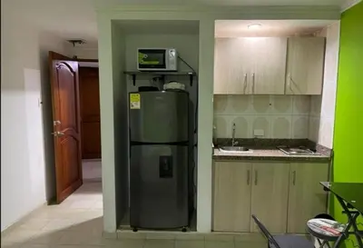 a kitchen with a refrigerator and a microwave at El Conquistador in Cartagena de Indias